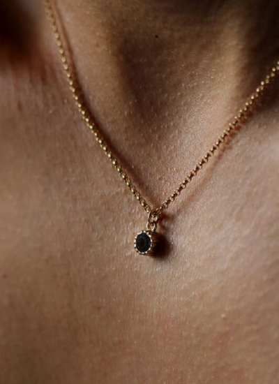A golden ball bead chain, with a Black Onyx drop stone. Belle necklace  by Leah Yard